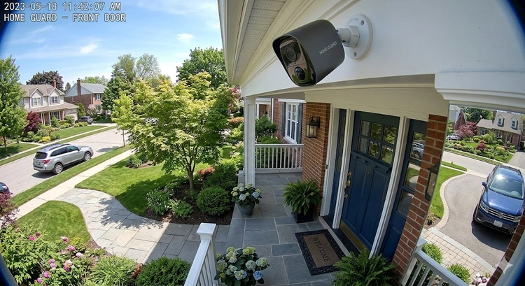 home security camera buying guide showing outdoor camera mounted on house exterior