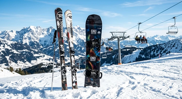 Ski vs snowboard for beginners — side-by-side comparison on a groomed mountain slope